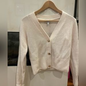 & Other Stories cream cardigan with gold strawberry buttons.